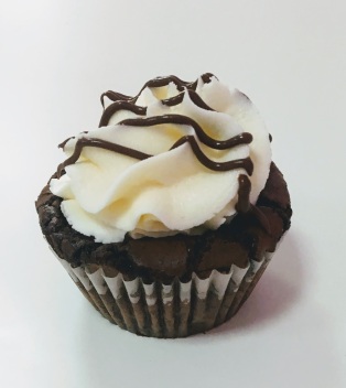 Brownie like nutella infused kake with vanilla buttercream frosting topped with nutella drizzle.