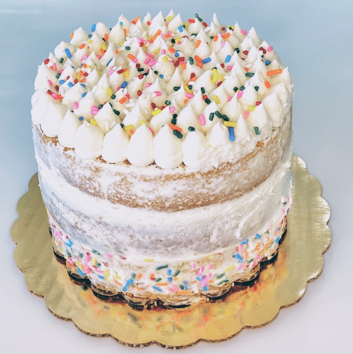 Moist vanilla naked kake with vanilla buttercream frosting decorated with sprinkles. For 10 people $40, for 20 people $80. (Can be made in flavor of choice, prices vary depending on flavor)