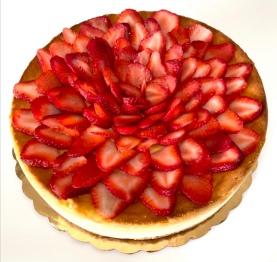Creamy vanilla cheesecake decorated with sliced strawberry design with graham cracker crust. $55 serving 8-10 people.