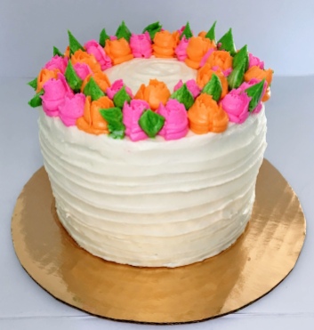 Moist vanilla kake with vanilla buttercream frosting decorated with a flower design. For 10 people $50, for 20 people $100. (Can be made in flavor of choice, prices vary depending on flavor).