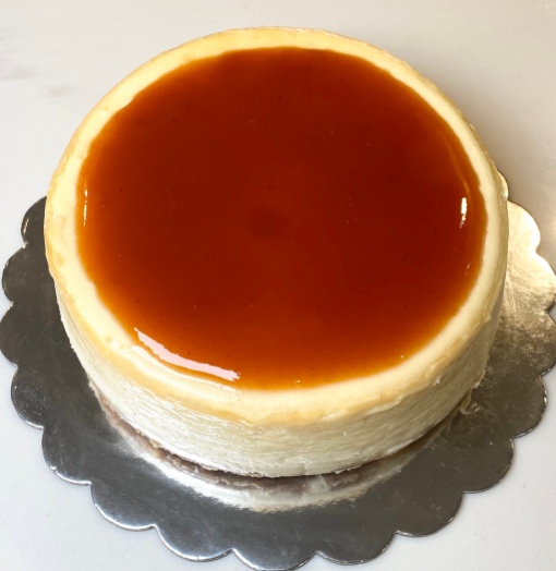 Creamy vanilla cheesecake topped with guava marmalade with graham cracker crust. $50 serving 8-10 people. (Topping can be changed for any of the toppings on the toppings list).